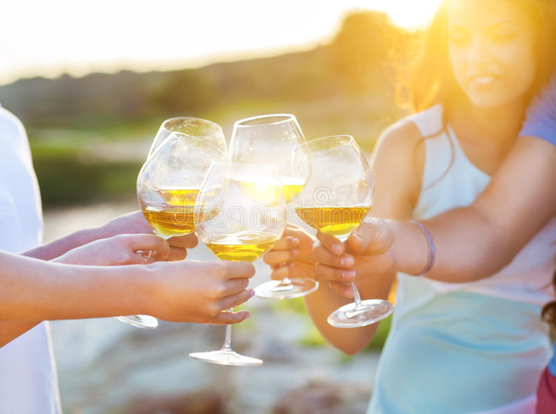 people-holding-glasses-white-wine